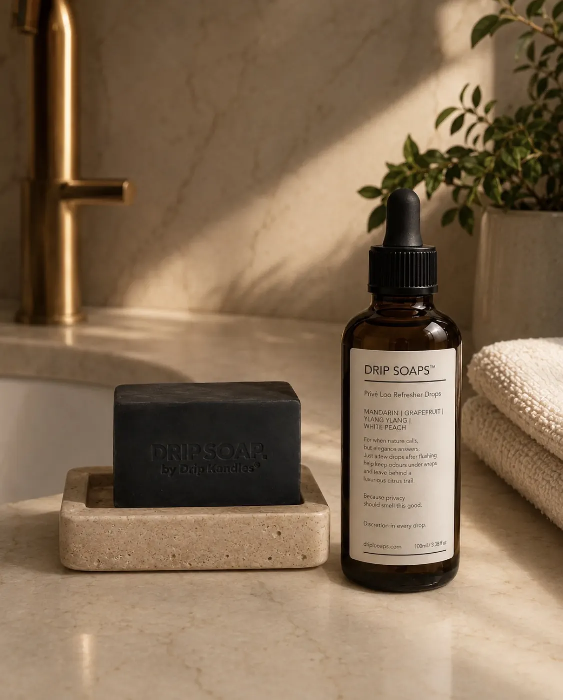 DRIP SOAPS™ dropper top amber bottle styled for a luxury bathroom scene